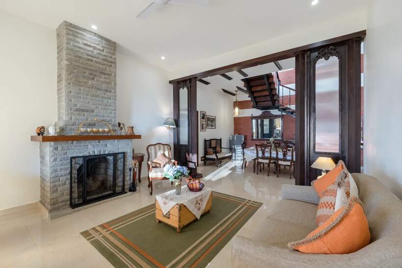 Living room with stone fireplace and sofas